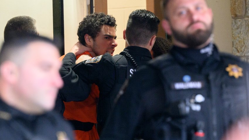 HOLLIDAYSBURG, PENNSYLVANIA – DECEMBER 10: Suspected shooter Luigi Mangione is led into the Blair County Courthouse for an extradition hearing December 10, 2024 in Hollidaysburg, Pennsylvania. Mangione has been arraigned on weapons and false identification charges related to the fatal shooting of United Healthcare CEO Brian Thompson in New York City. Mangione is incarcerated in the State Correctional Institution in Huntingdon, Pennsylvania awaiting extradition to New York.