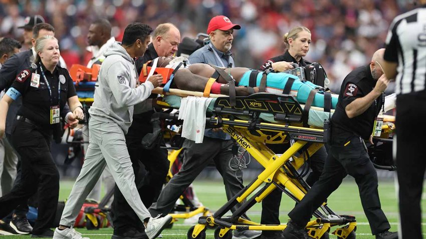 HOUSTON, TEXAS – DECEMBER 15: Grant DuBose #88 of the Miami Dolphins is stretchered off the field after an injury in the third quarter against the Houston Texans at NRG Stadium on December 15, 2024 in Houston, Texas. (Photo by Tim Warner/Getty Images)