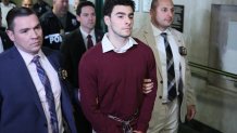 Luigi Nicholas Mangione (C) arrives at Manhattan Criminal Court in New York on December 23, 2024. Mangione, 26, is accused of shooting UnitedHealthcare chief executive Brian Thompson on a Manhattan street on December 4. (Photo by CHARLY TRIBALLEAU / AFP) (Photo by CHARLY TRIBALLEAU/AFP via Getty Images)