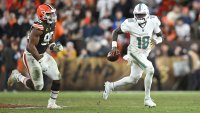 CLEVELAND, OHIO – DECEMBER 29: Tyler Huntley #18 of the Miami Dolphins is chased by Myles Garrett #95 of the Cleveland Browns during the third quarter at Huntington Bank Field on December 29, 2024 in Cleveland, Ohio. (Photo by Nick Cammett/Getty Images)