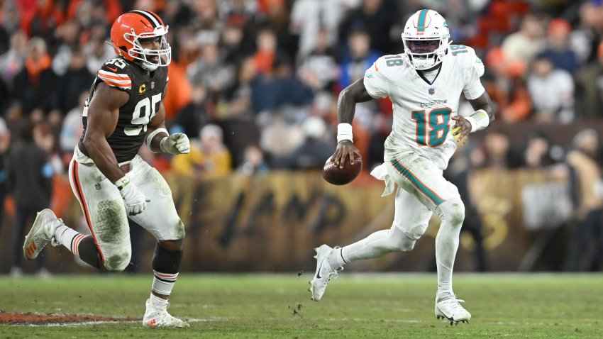 CLEVELAND, OHIO – DECEMBER 29: Tyler Huntley #18 of the Miami Dolphins is chased by Myles Garrett #95 of the Cleveland Browns during the third quarter at Huntington Bank Field on December 29, 2024 in Cleveland, Ohio. (Photo by Nick Cammett/Getty Images)