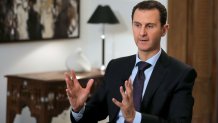 TOPSHOT - Syrian President Bashar al-Assad gestures during an exclusive interview with AFP in the capital Damascus on February 11, 2016. (Photo by JOSEPH EID / AFP) (Photo by JOSEPH EID/AFP via Getty Images)