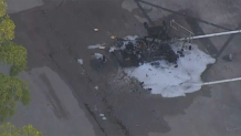The remnants of a fire in a parking lot in Fort Lauderdale after a fatal police shooting on Jan. 9, 2025.