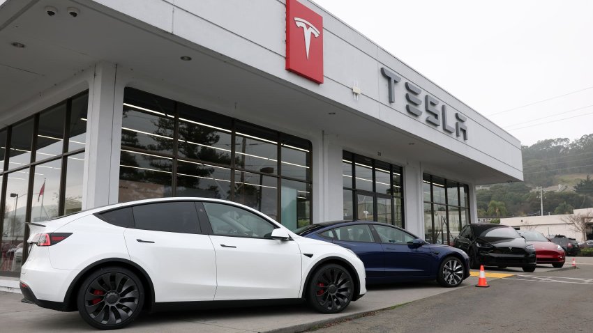 Tesla models Y and 3 are displayed at a Tesla dealership in Corte Madera, California, on Dec. 20, 2024.