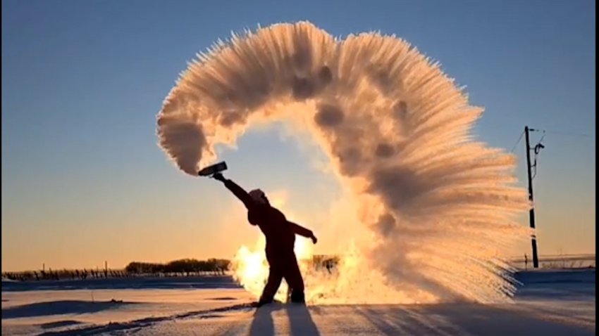 water throw in in Canada freezes into a half circle