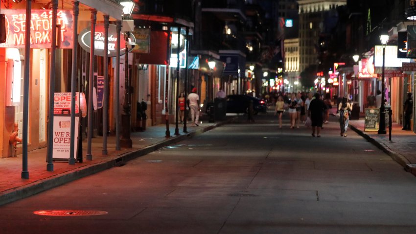 A deserted stretch of Bourbon Street in the French Quarter of New Orleans is seen Tuesday, July 14, 2020. Many bars are closed after after Governor John Bel Edwards recently ordered tighter restrictions to stop the spread of COVID-19.