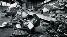 WASHINGTON, DC - JANUARY 21: FILE, Civil Air Medical Institute Official L. Lowrey takes notes among the wreckage of Air Florida Flight 90 crash, in Washington, DC on January 21, 1982. (Photo by Joel Richardson/The Washington Post via Getty Images)