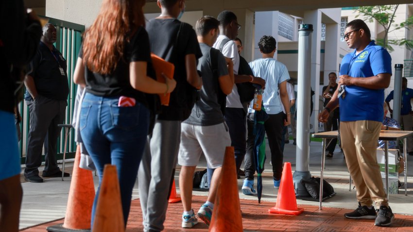 PEMBROKE PINES, FLORIDA – JUNE 24: Matthew Boodoo, campus monitor, watches as summer school students walk through a newly installed CEIA OpenGate weapons detection system at Charles W. Flanagan High School on June 24, 2024 in Pembroke Pines, Florida. As part of the Broward County Public School’s ongoing effort to enhance safety and security measures in schools, the Broward County School Board approved using walk-through metal detectors on high school campuses. Following the initiative’s launch at two high school summer sites, the rollout of walk-through metal detectors at District high schools will continue at the start of the 2024/25 school year. (Photo by Joe Raedle/Getty Images)