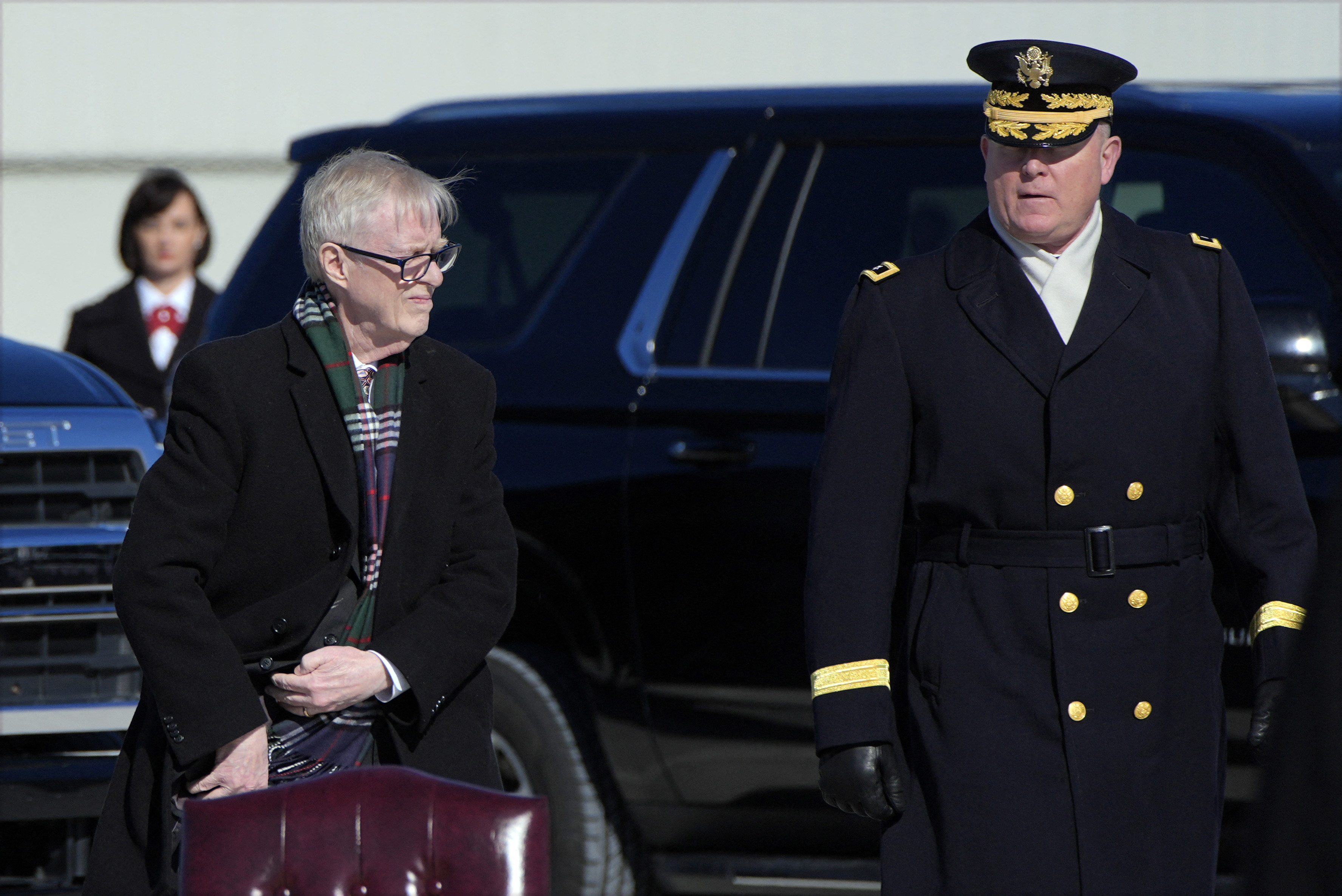 Carter's son Jack Carter and Maj. Gen. Trevor Bredenkamp watch as Carter's casket is placed into Special Air Mission 39 at Dobbins Air Reserve Base in Marietta, Georgia.