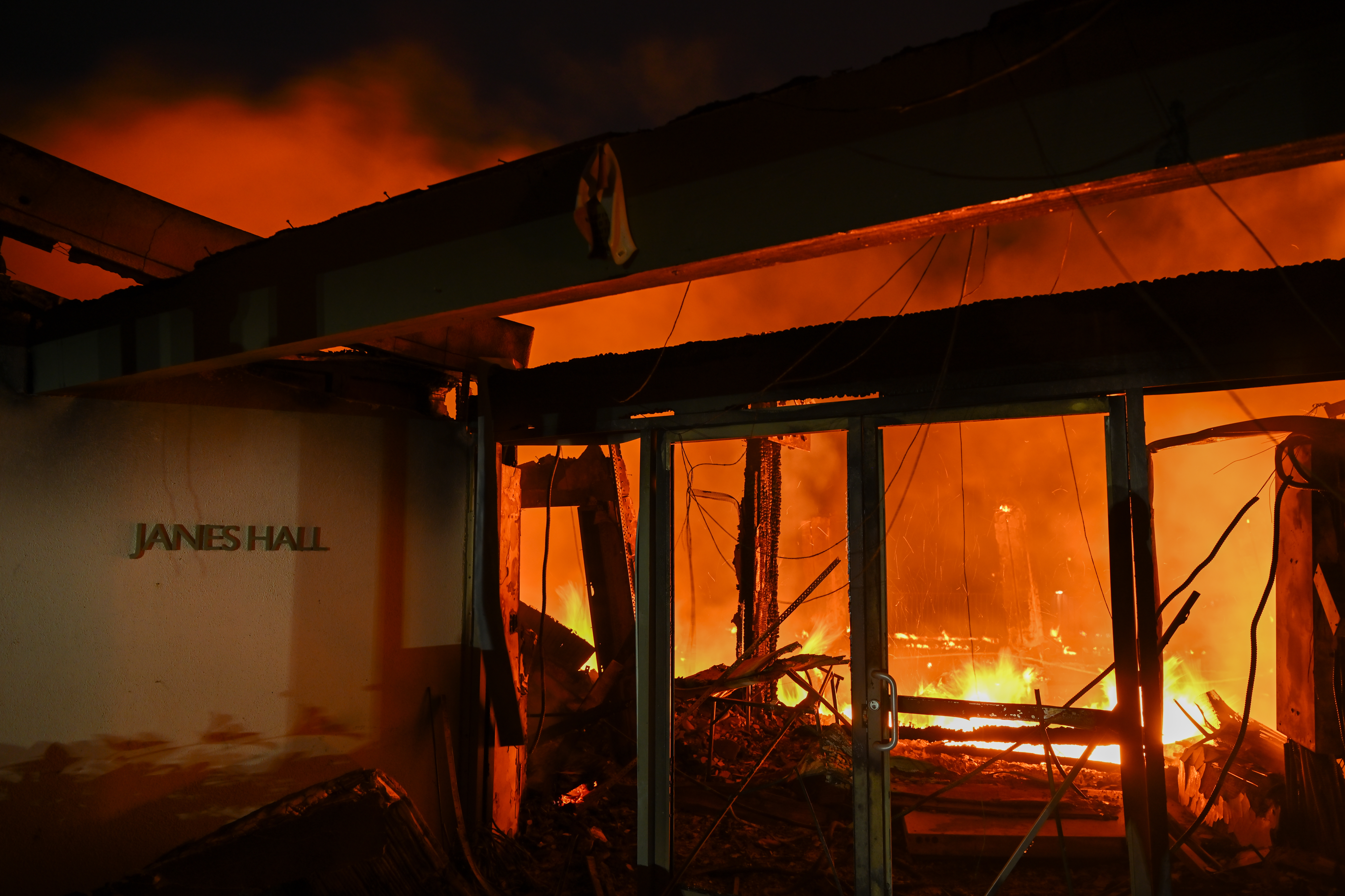 CALIFORNIA, UNITED STATES – JANUARY 8: A house in on fire as residents try to escape the site in Pacific Palisades, California, Los Angeles, United States on January 8, 2025. (Photo by Tayfun Coskun/Anadolu via Getty Images)