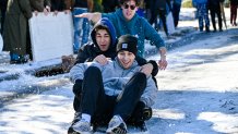TALLAHASSEE, FLORIDA - JANUARY 22: People use a table to sled in the snow following an historic winter storm on January 22, 2025 in Tallahassee, Florida. According to the National Weather Service, the winter storm brought record-breaking snowfall to the state and forced the closure of airports, major highways and schools in north Florida. (Photo by Miguel J. Rodriguez Carrillo/Getty Images)