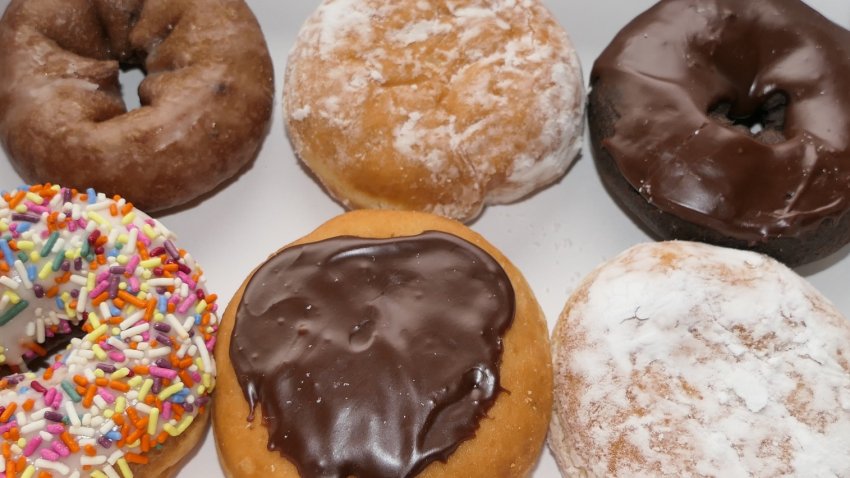 A file photo of a half dozen Dunkin' doughnuts.