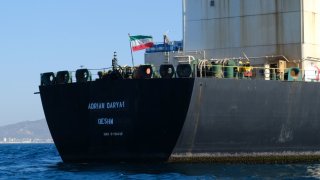 An Iranian flag flutters on board the Adrian Darya oil tanker, formerly known as Grace 1, off the coast of Gibraltar on Aug. 18, 2019.