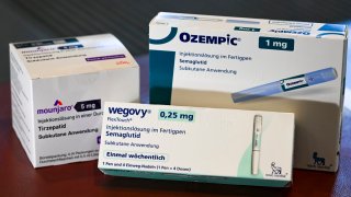 Packages of weight loss drugs Wegovy, Ozempic and Mounjaro.