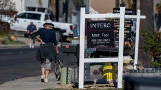 Real estate signs in front of homes in Discovery Bay, California, on Nov. 7, 2024.
