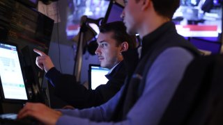  Traders work on the floor of the New York Stock Exchange during morning trading on February 03, 2025 in New York City. 