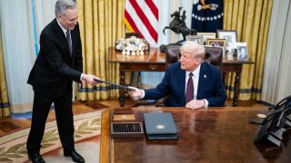 AI and Crypto Czar David Sacks speaks with President Donald J Trump as he signs executive orders in the Oval Office at the White House on Jan. 23, 2025 in Washington, DC.