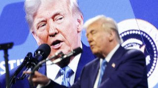 A screen shows U.S. President Donald Trump as he speaks at an FII Priority Saudi Investment summit in Miami, Florida, U.S., Feb. 19, 2025. 