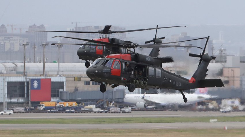 FILE - Two Sikorsky UH-60 "Black Hawk" helicopters