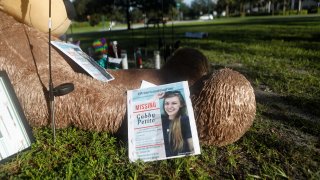File. A makeshift memorial dedicated to missing woman Gabby Petito is located near City Hall on September 20, 2021 in North Port, Florida. A body has been found by authorities in Grand Teton National Park in Wyoming that fits the description of Petito, who went missing while on a cross-country trip with her boyfriend Brian Laundrie.
