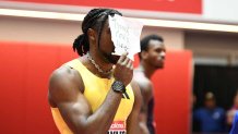 BOSTON, MA - FEBRUARY 02: Noah Lyles of the United States holds a sign "Tyreek could never" after winning the men's 60m in the New Balance Indoor Grand Prix on February 2, 2025, at the TRACK at new balance in Boston, MA. Lyles won with a time of 6.52. (Photo by Erica Denhoff/Icon Sportswire via Getty Images)