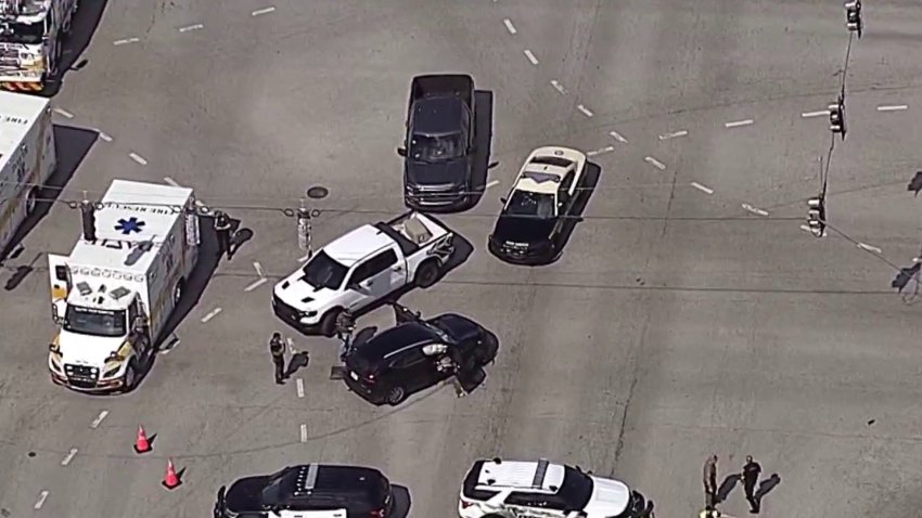 Chopper6 captured video of a white pickup and black vehicle on Griffin Road and Davie Road, the latter of which appeared to have its doors open and airbags deployed.