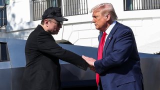 U.S. President Donald Trump and Tesla CEO Elon Musk shake hands in front of a Tesla Cybertruck, at the White House in Washington, D.C., U.S., March 11, 2025.