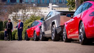 U.S. President Donald Trump, accompanied by White House Senior Advisor, Tesla and SpaceX CEO Elon Musk, and his son X Æ A-Xii, speaks next to a Tesla Model Y, a Cyber Truck, and two Model S vehicles on the South Lawn of the White House on March 11, 2025 in Washington, DC.