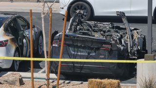 Burned Teslas are shown at a Tesla Collision Center after an individual used incendiary devices to set several vehicles on fire on March 18, 2025 in Las Vegas, Nevada.