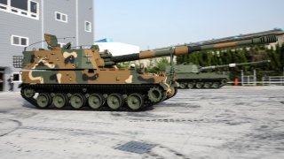 A worker tests a Hanhwa K9 Howitzer at Hanwha Aerospace Co.’s manufacturing facility in Changwon, South Korea, on Thursday, April 18, 2024. Hanwha Aerospace Co., Korea’s leading defense contractor, has been making ground weapons for almost 50 years, their old-school armored vehicles and munitions are in high demand.