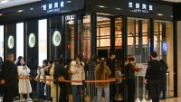 Shoppers line up to shop at a Laopu Gold outlet in Deji Plaza in Nanjing, China, on Feb. 21, 2025.