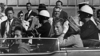 FILE – This Nov. 22, 1963 file photo shows President John F. Kennedy riding in motorcade with first lady Jacqueline Kenndy in Dallas, Texas.