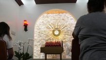 Parishioners pray in the perpetual adoration chapel