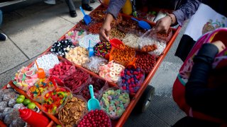 A street vendor sells sweet snacks in Mexico City