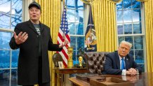 Elon Musk speaks as US President Donald Trump looks on in the Oval Office of the White House in Washington, DC, on February 11, 2025. Tech billionaire Elon Musk, who has been tapped by President Donald Trump to lead federal cost-cutting efforts, said the United States would go "bankrupt" without budget cuts. Musk leads the efforts under the newly created Department of Government Efficiency (DOGE), and was speaking at the White House with Trump, who has in recent weeks unleashed a flurry of orders aimed at slashing federal spending. (Photo by Jim WATSON / AFP) (Photo by JIM WATSON/AFP via Getty Images)