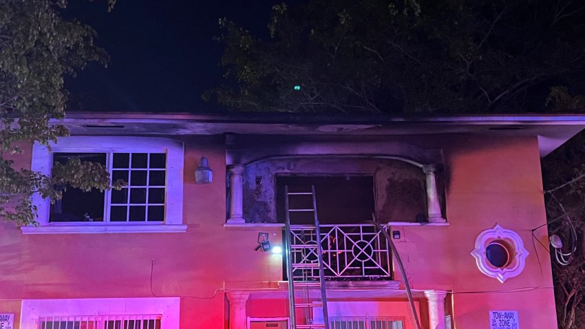 A woman had to be rescued from a fire at a Miami duplex where several animals also lived late Monday, according to Miami Fire Rescue.