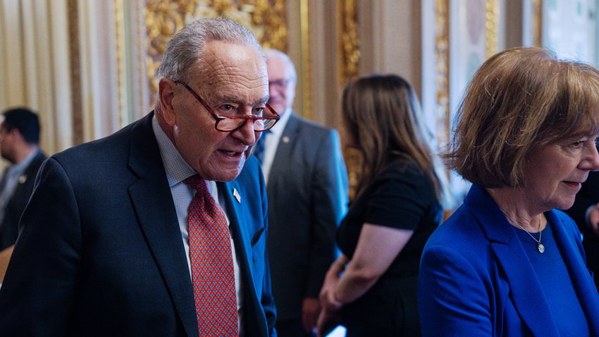 Senate Minority Leader Chuck Schumer, D-N.Y., and Sen. Tina Smith, D-Minn., arrive for the Senate Democrats’ lunch meeting in the U.S. Capitol on March 13, 2025.