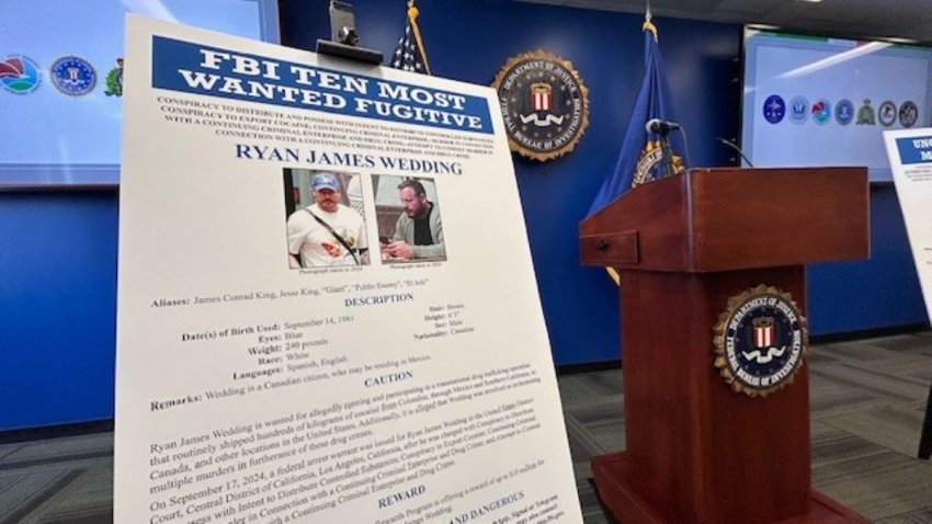 The FBI displays wanted posters at Thursday March 6, 2025 news conference.