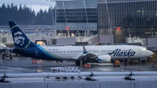 An Alaska Airlines Boeing 737 MAX 9 plane sits at a gate at Seattle-Tacoma International Airport on Jan. 6, 2024.