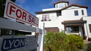 A For Sale sign is displayed outside a home in Los Angeles, Aug. 16, 2024.