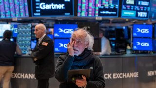 Traders work on the floor of the New York Stock Exchange. 