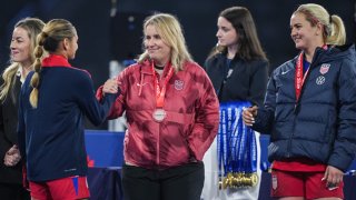 United States head coach Emma Hayes shakes hands with Gisele Thompson #15 of the United States after playing Japan at Snapdragon Stadium on February 26, 2025 in San Diego, California. 