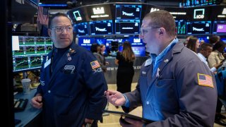 Traders work on the floor at the New York Stock Exchange on April 2, 2025.