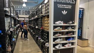 Customers shop in an Adidas store on April 4, 2025 in Miami, Florida.