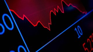 FILE PHOTO: A screen tracks trading on the floor at the New York Stock Exchange (NYSE) after the closing bell in New York City, U.S., April 4, 2025.