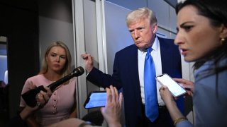 US President Donald Trump speaks to reporters while in flight on Air Force One, en route to Joint Base Andrews on April 6, 2025. 
