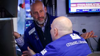Traders work on the floor at the New York Stock Exchange (NYSE) in New York City, U.S., April 8, 2025. 