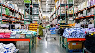 People shop in Bayonne, New Jersey on April 8, 2025.