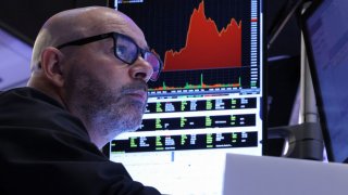 A trader works on the floor at the New York Stock Exchange (NYSE) in New York City, U.S., April 11, 2025.