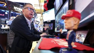 Traders work on the floor of the New York Stock Exchange (NYSE) at the opening bell in New York City, on April 14, 2025.